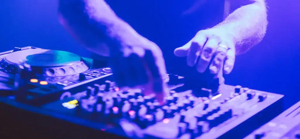 dj-hands-scaled-playing-his-console